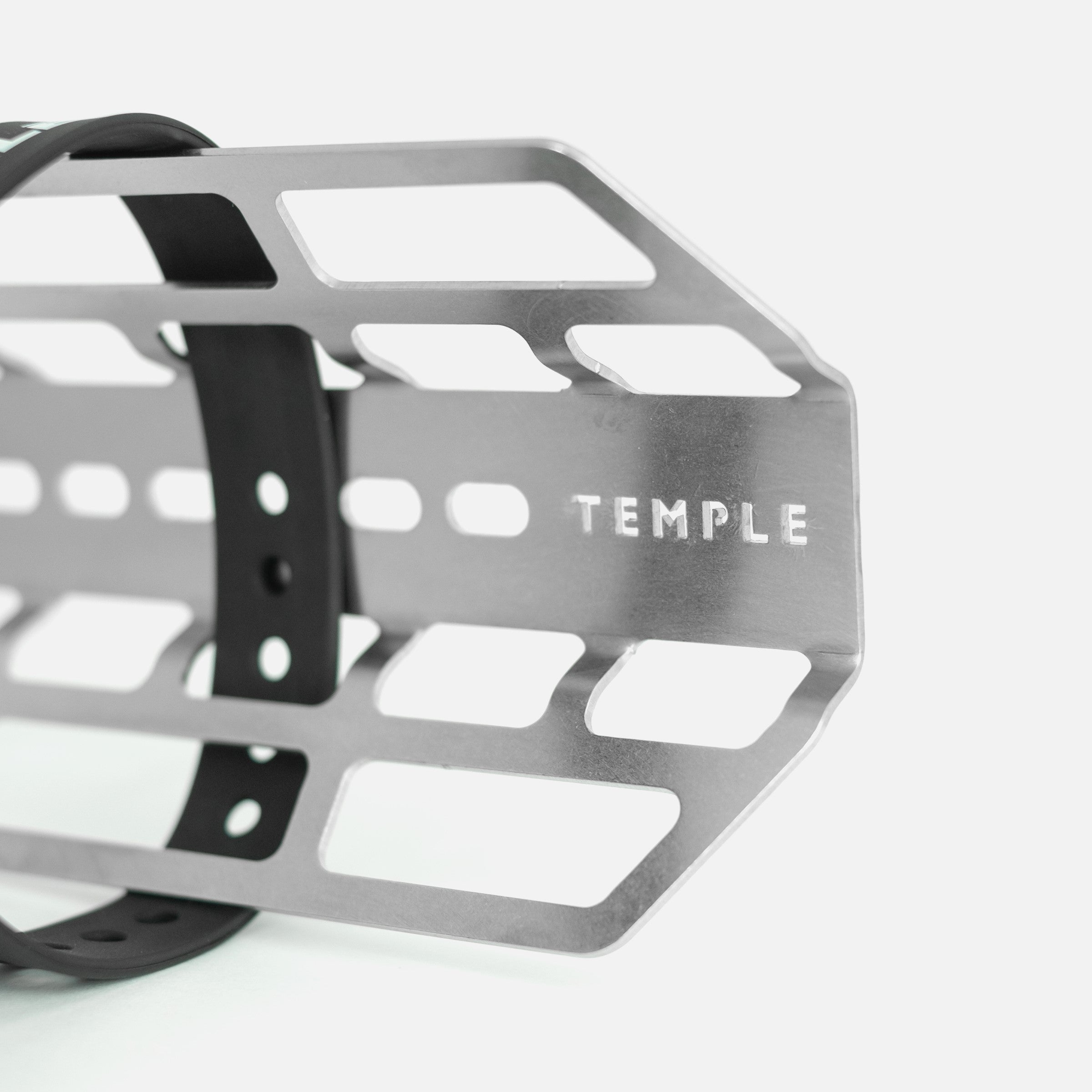 Close up of stainless steel cargo cage with Temple engraving.