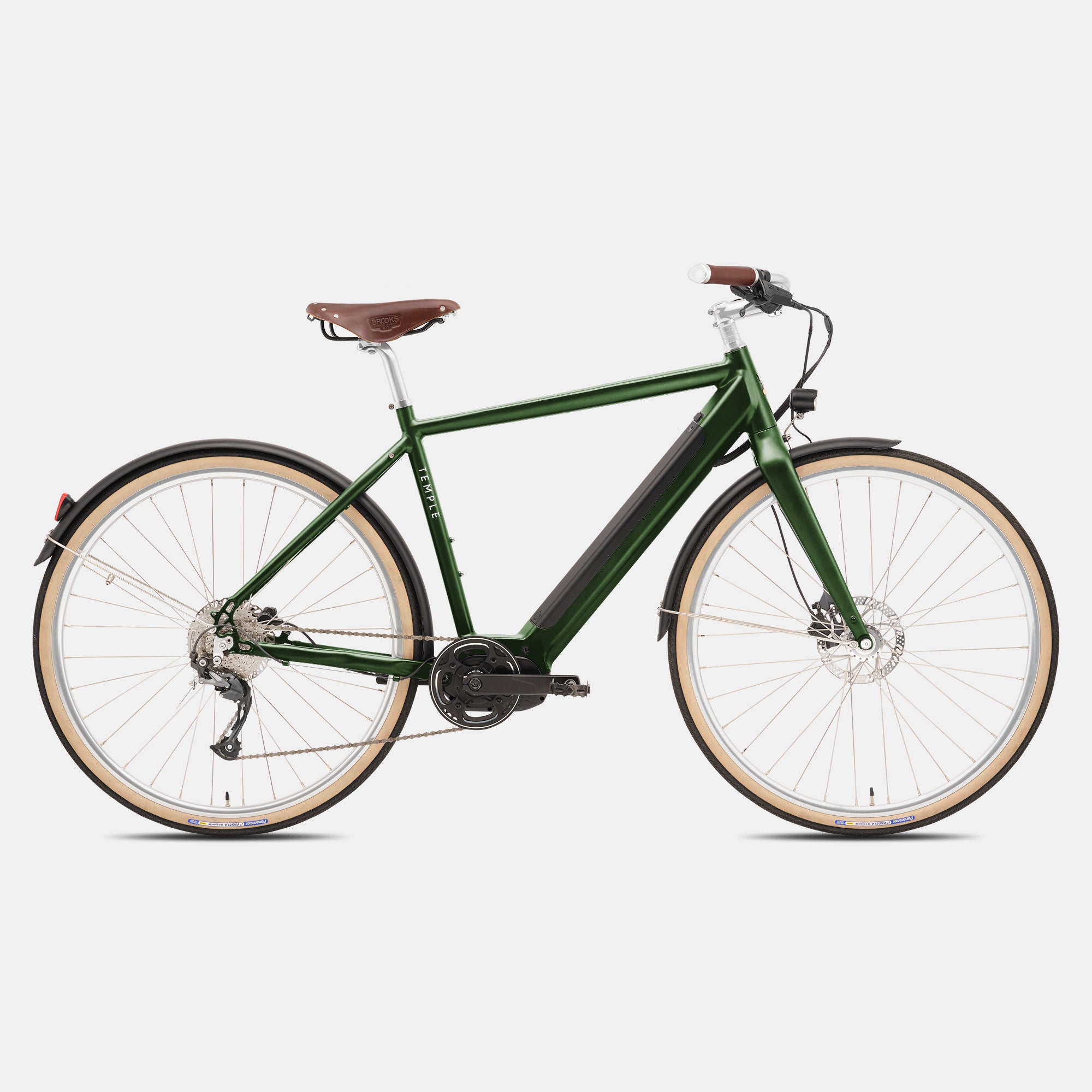 Classic adventure e-bicycle in dark green, studio setting.