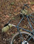 Touring bike with mini panniers attached, country setting.