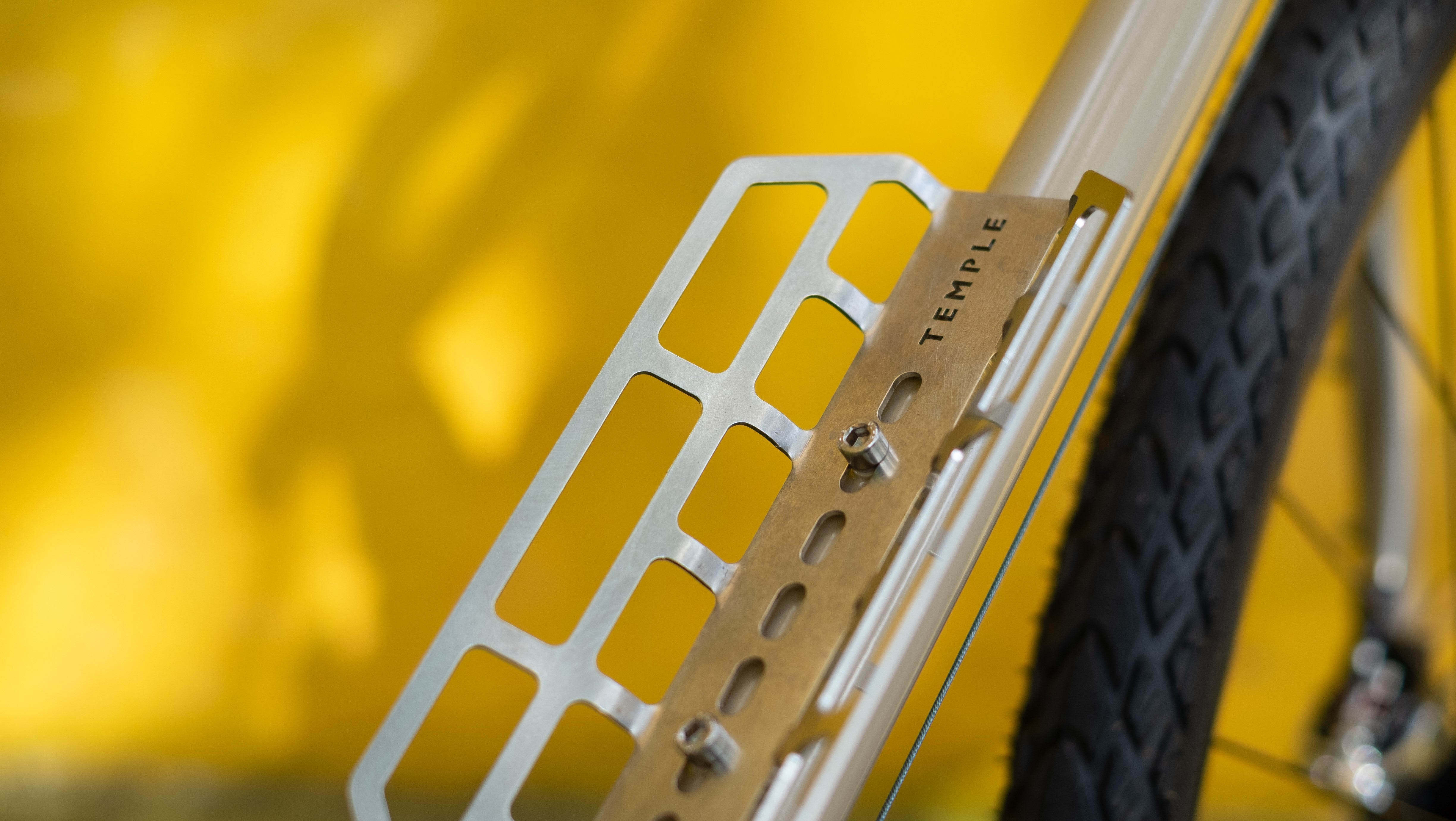 Stainless steel cargo cage mounted onto a Temple Cycles steel framed bike.