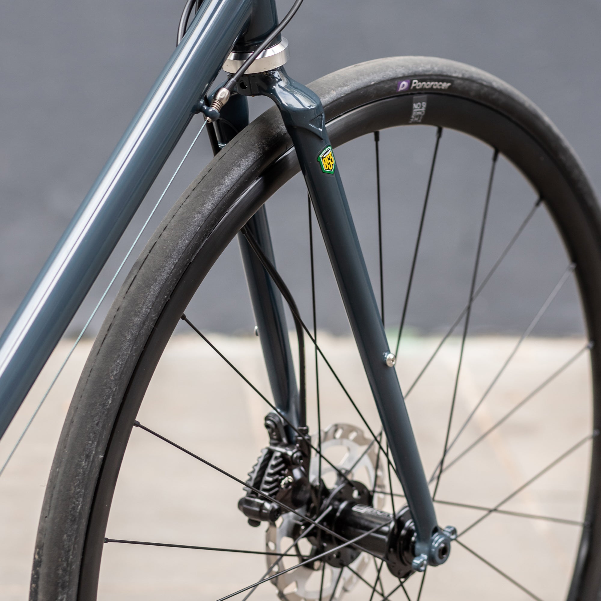 Front wheel hand built by Hunt on a fast, navy Road Bike 2.