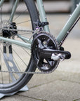 Shimano 12-speed groupset chain on a lightweight steel framed adventure bike.