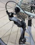 Shimano 105 brake callipers on the back wheel of an adventure touring bike.