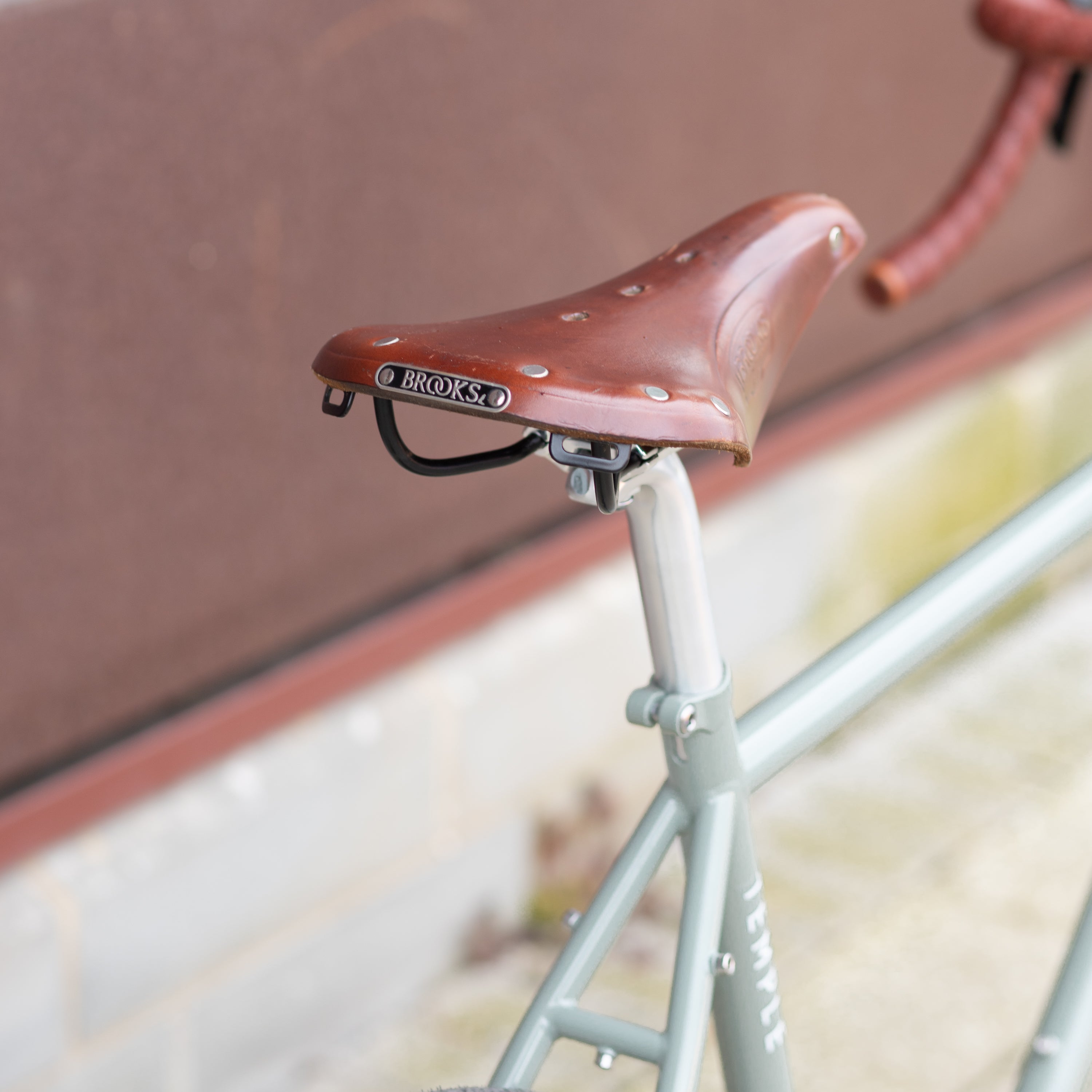 Brooks 17 leather saddle on green lightweight adventure bike.