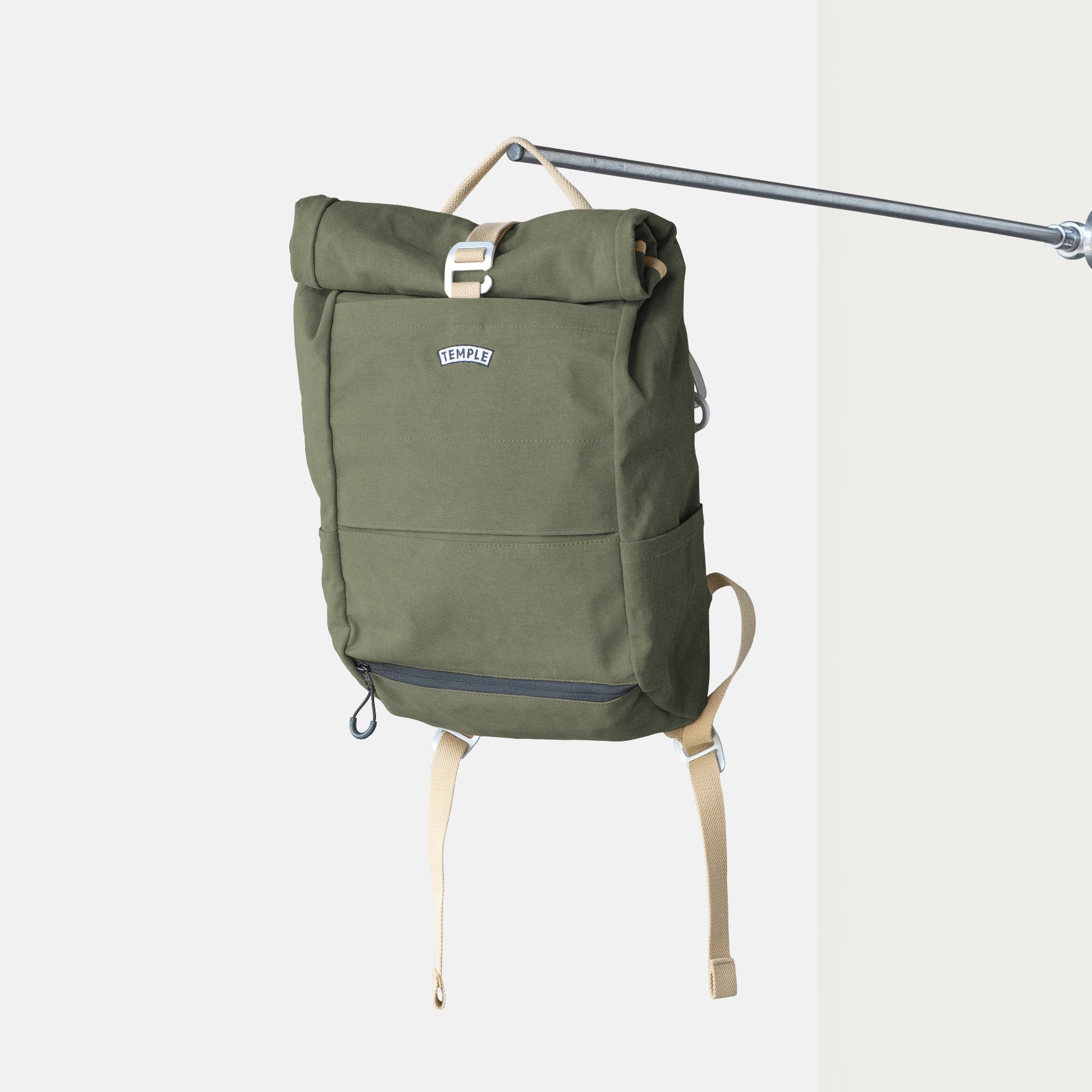 Fern Green roll-top weather-resistant pannier backpack with canvas straps.