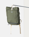 Fern Green roll-top weather-resistant pannier backpack with canvas straps.