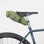 Waterproof, cycling saddle bag in green, studio setting.