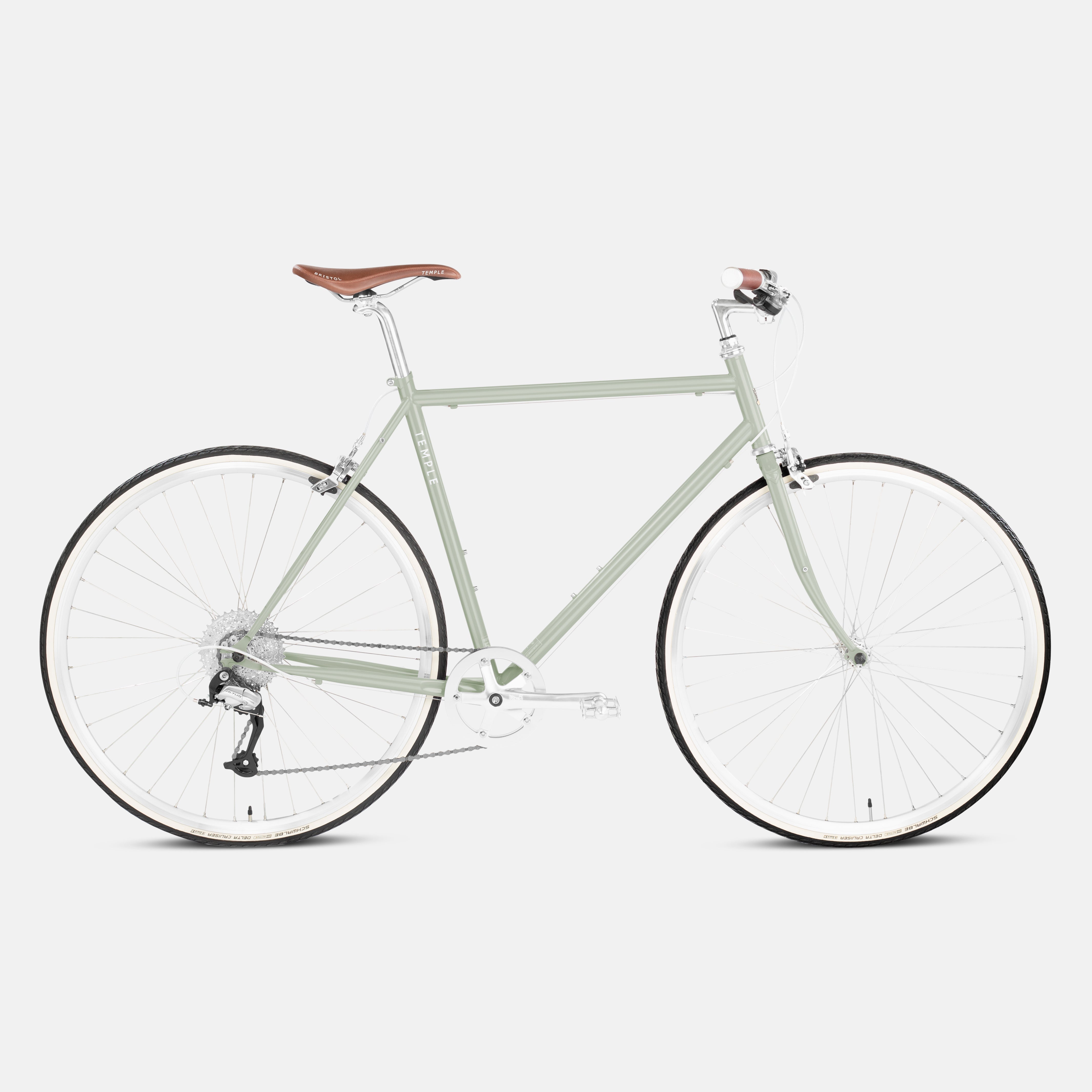 Steel commuter bike in light green, studio setting.