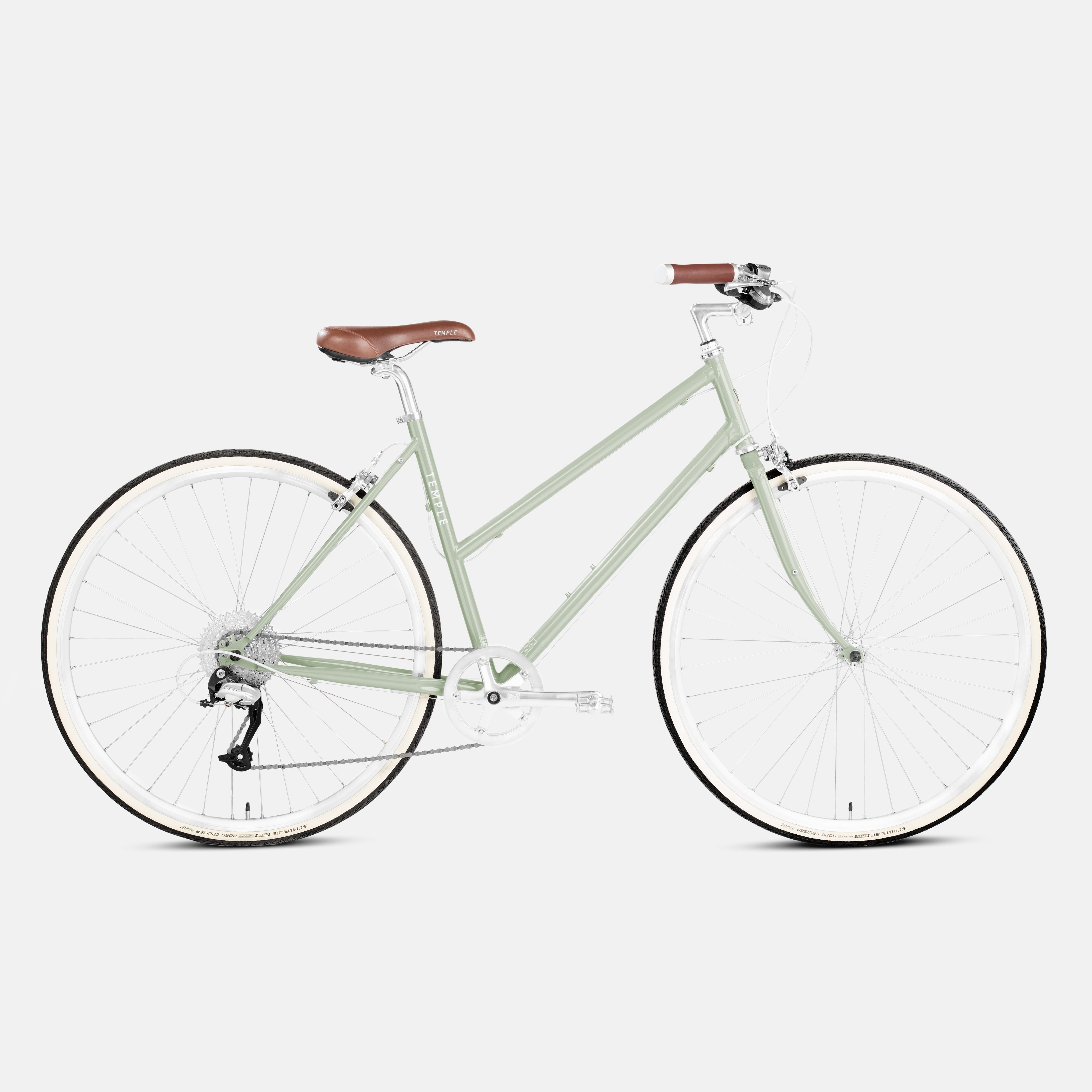 Comfortable step through steel bike in green, studio setting.