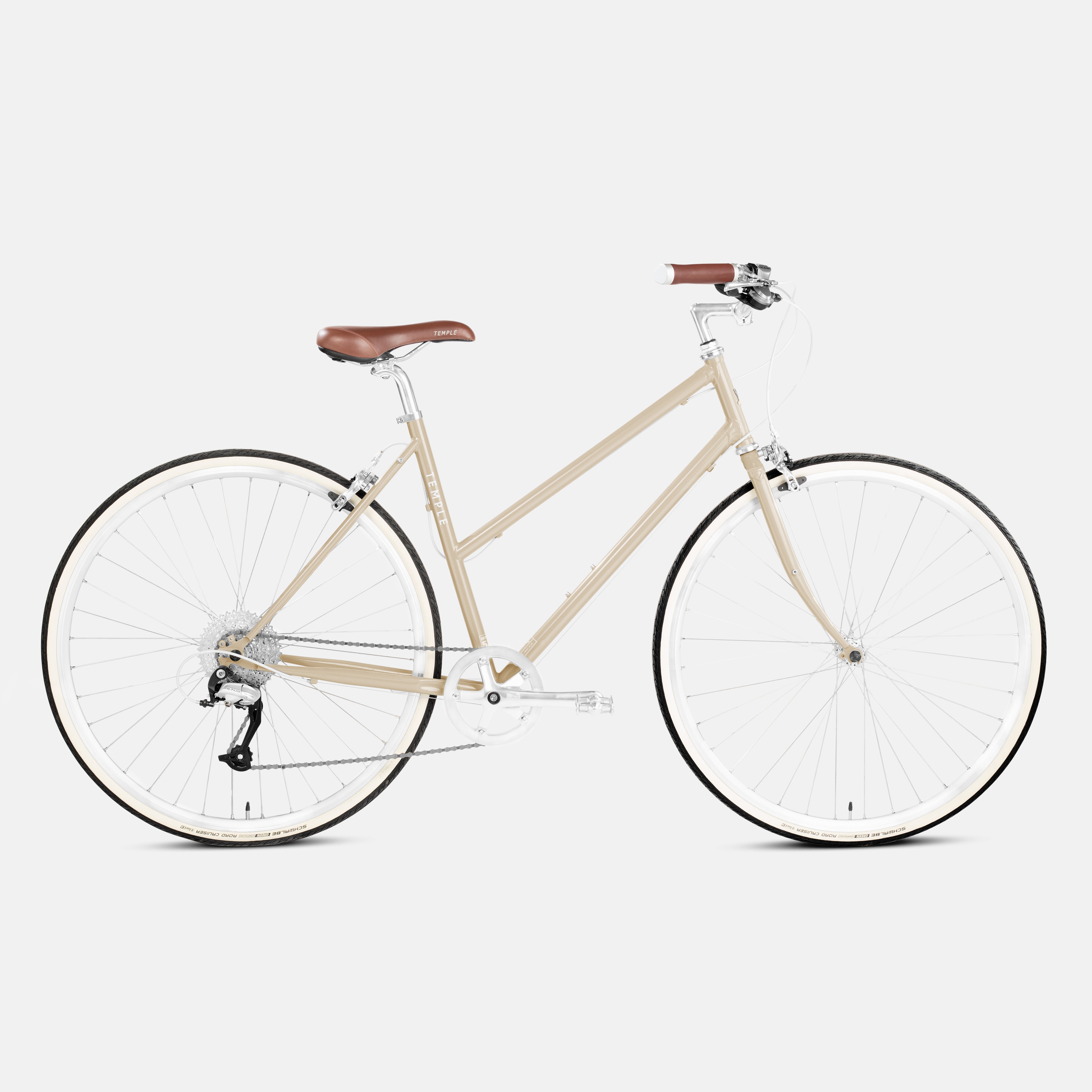 Lightweight commuting bike in beige, studio setting.