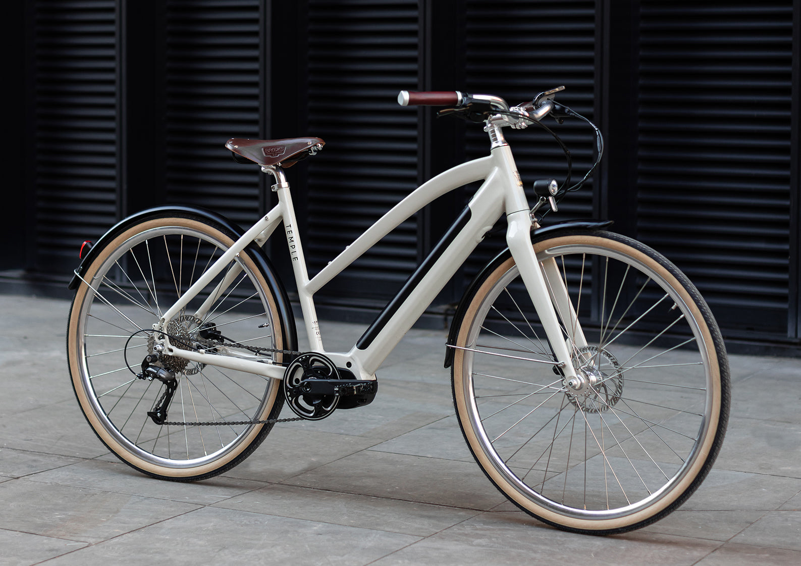 Step Through electric cream bike, urban setting.