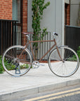 Woodland Brown Classic Lightweight bike in an urban setting.