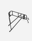 Black steel rear bike rack with side support rails and wide top platform designed for panniers, cargo, and touring setups on modern or classic bike frames.