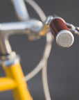 Laser-engraved Temple handlebars on a lightweight steel commuter bike.
