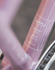 Temple Cycles specification detail on pink steel Step Through Lightweight bike.