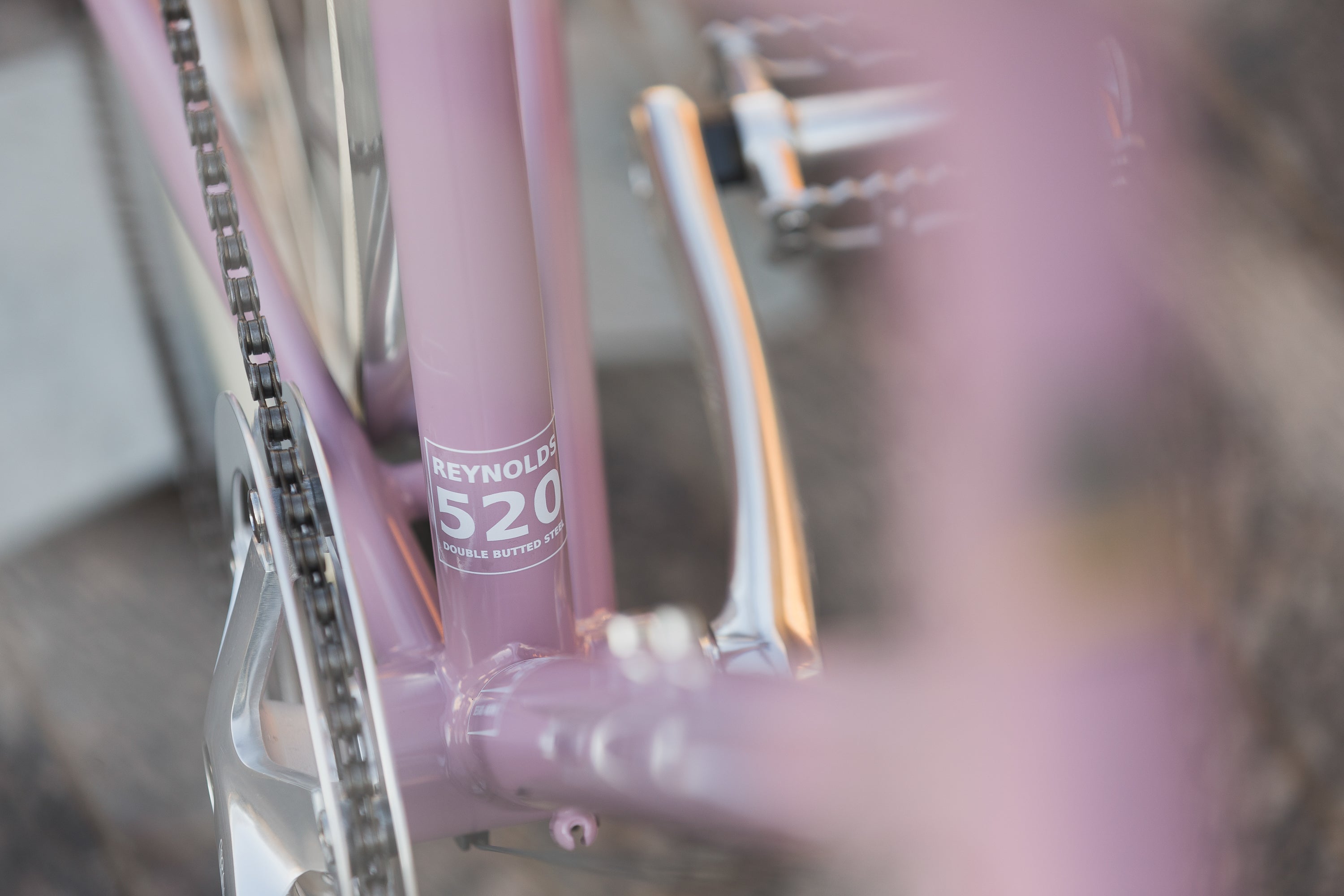 Timeless Reynolds Steel Frame on lightweight town bike in pink.
