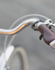Swept back handlebars on a lightweight steel bicycle.