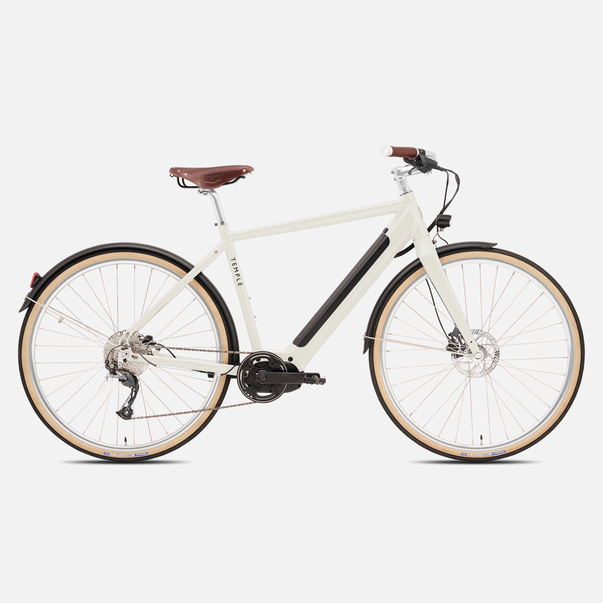 Versatile classic cream electric bike in a studio setting.