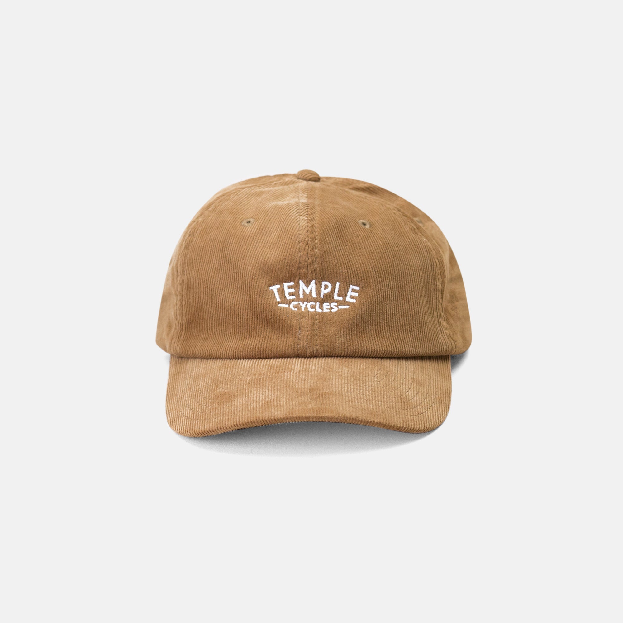 Front view of 6 panel men’s cap in beige, studio setting. 