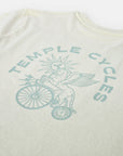 Unisex Clara x Temple Cycles graphic on sustainable, super soft T Shirt, studio setting. 