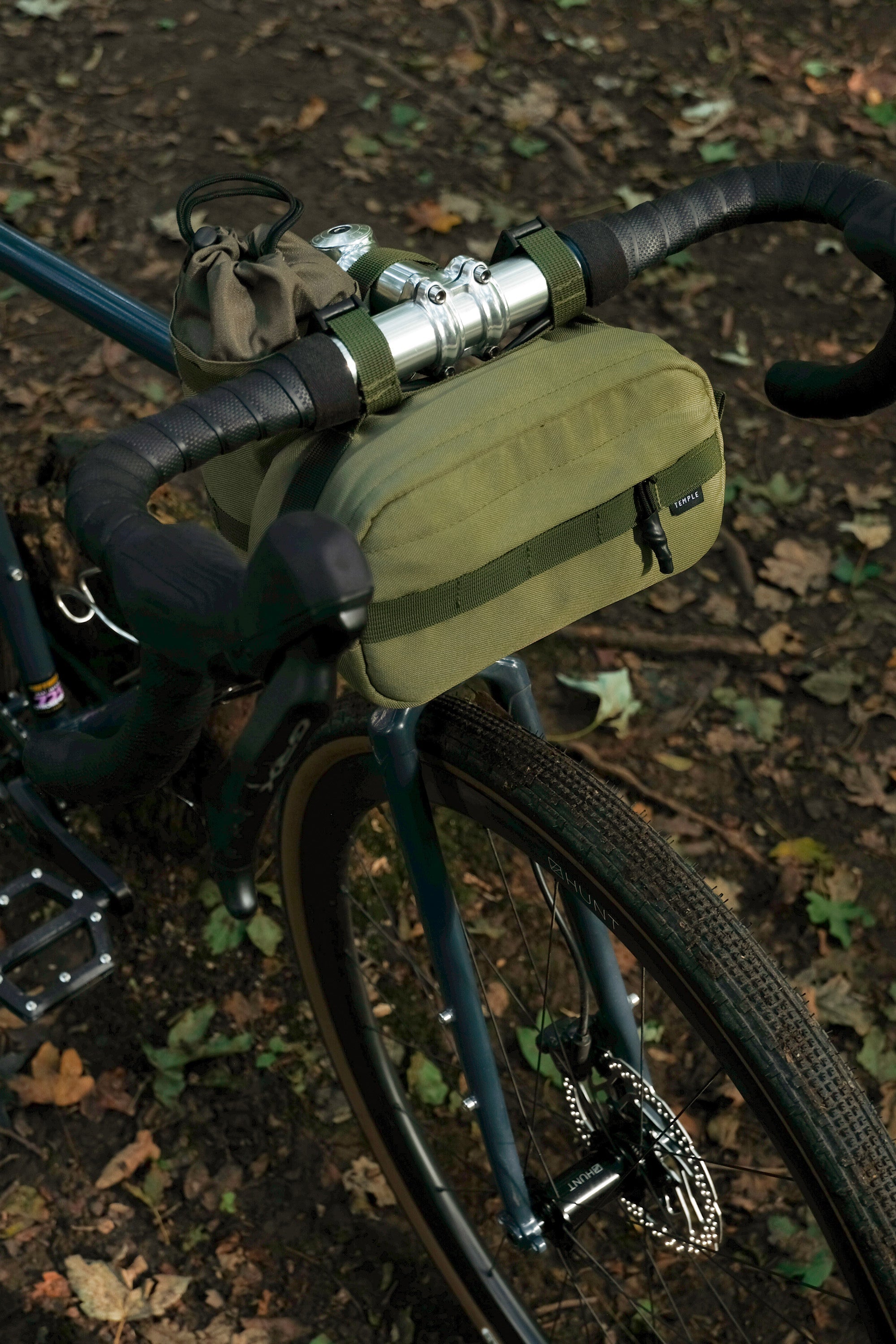 Two cycling bags attached with magnetic fastenings, rural setting.