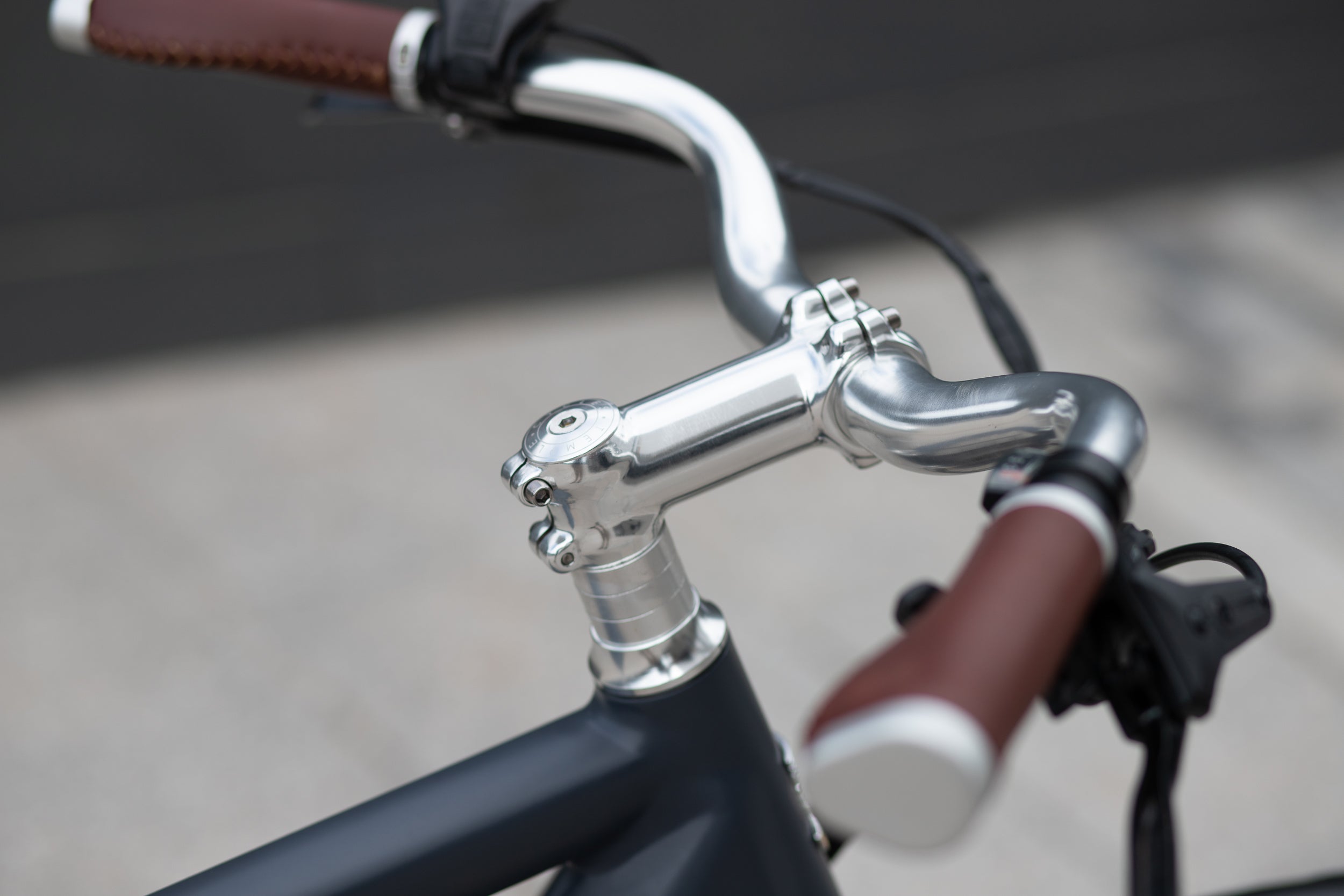 Neco silver headset with polished silver sweep handlebars on a classic vintage e-bike.