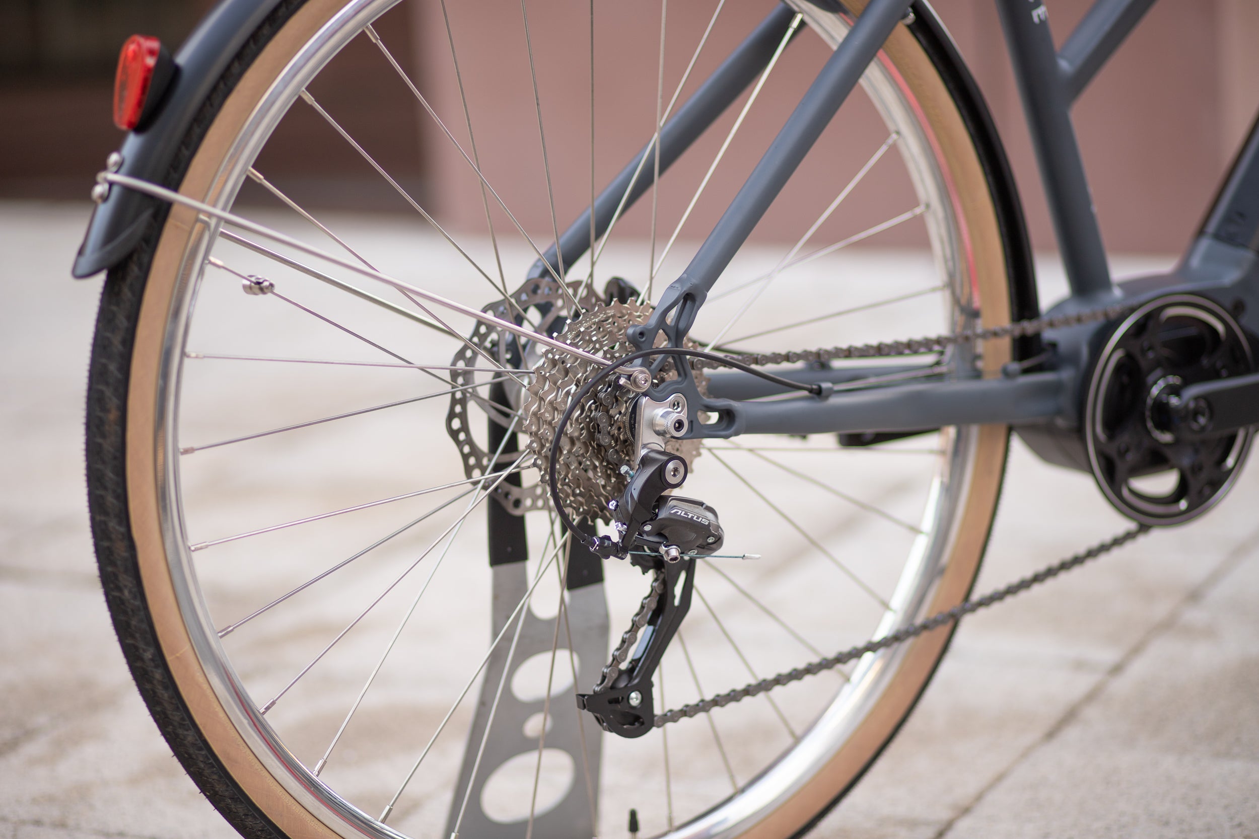 Rear wheel with a Shimano chain and Bafang chainset on a minimalist Step Through e-bike.