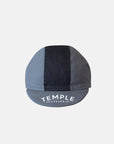 Temple branded peak of men’s cycling cap with black stripe, studio setting. 