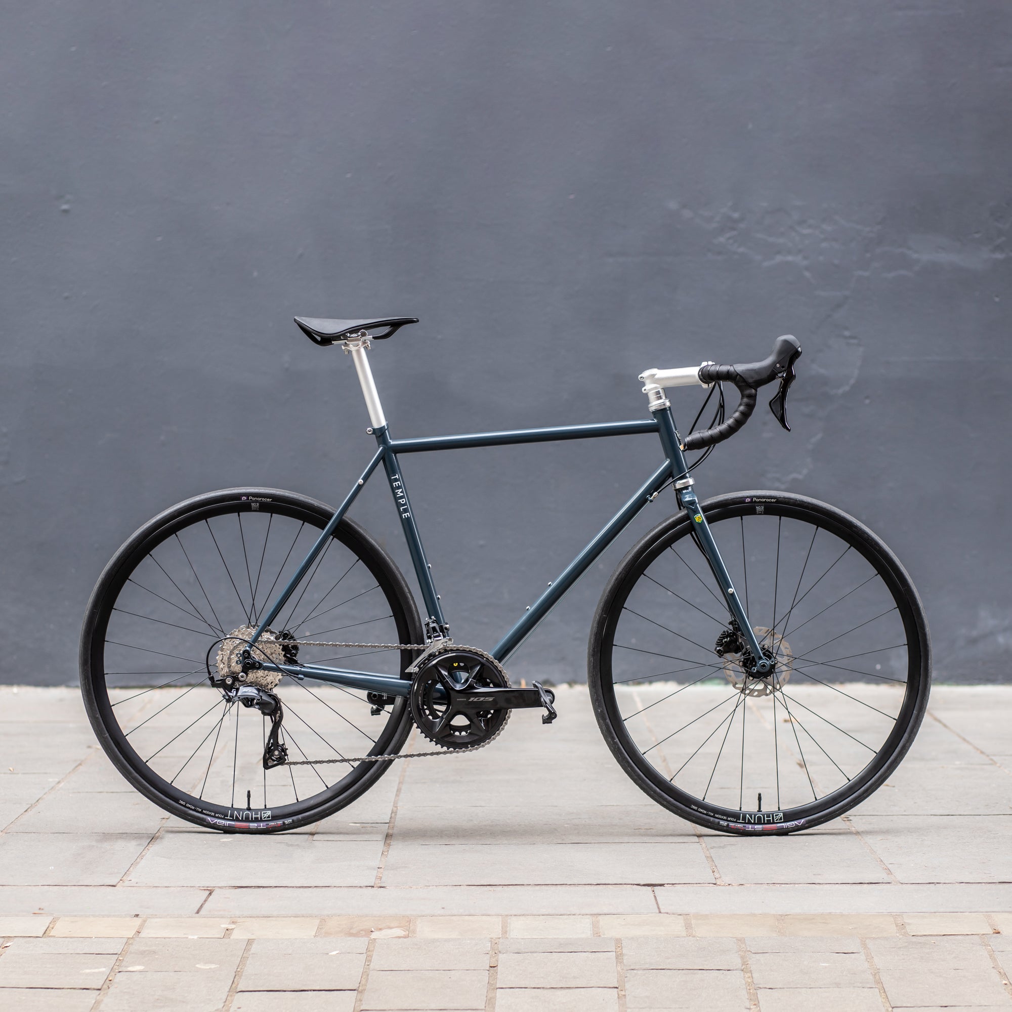 Navy, functional road bike, urban setting.