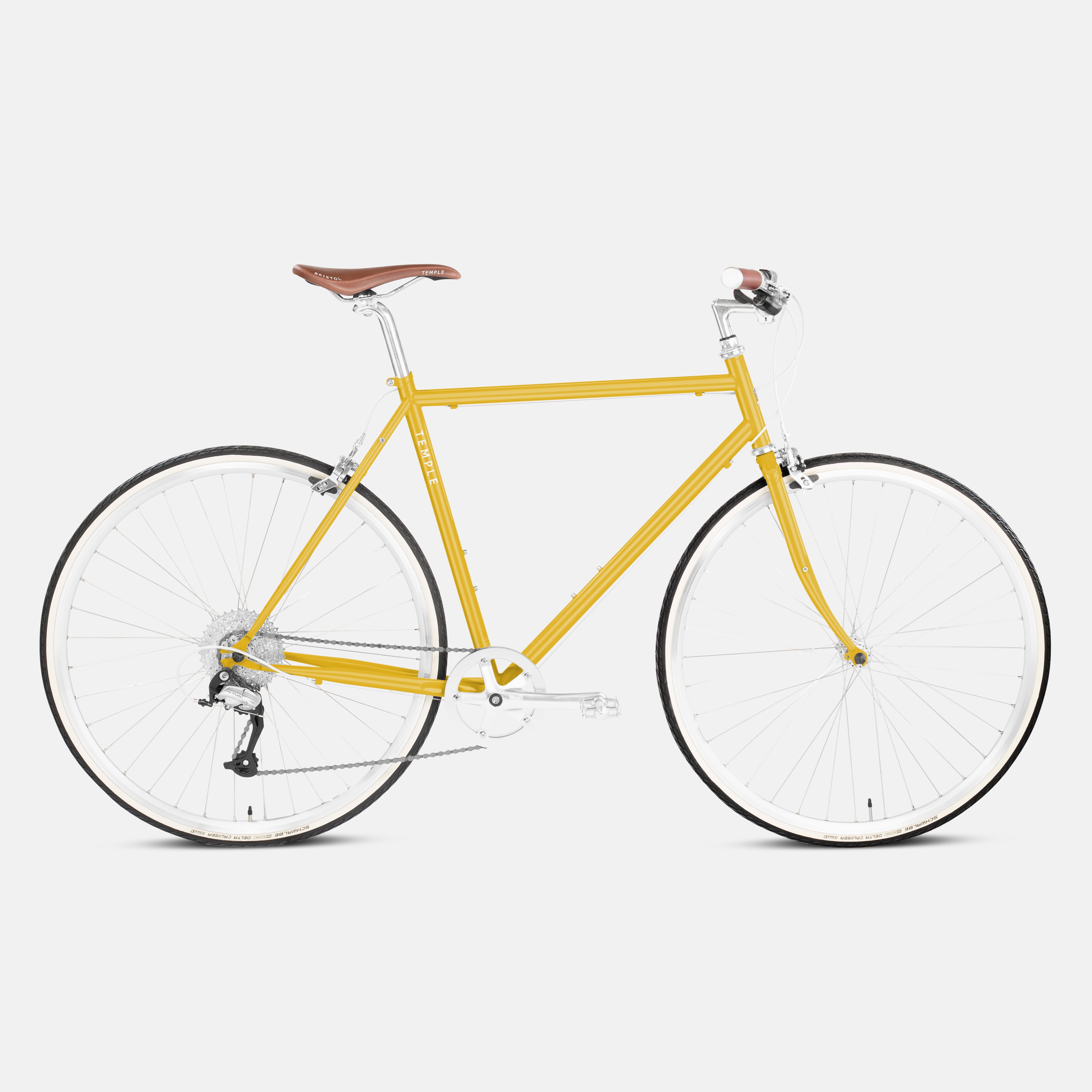 Mustard yellow steel bicycle in a studio setting.