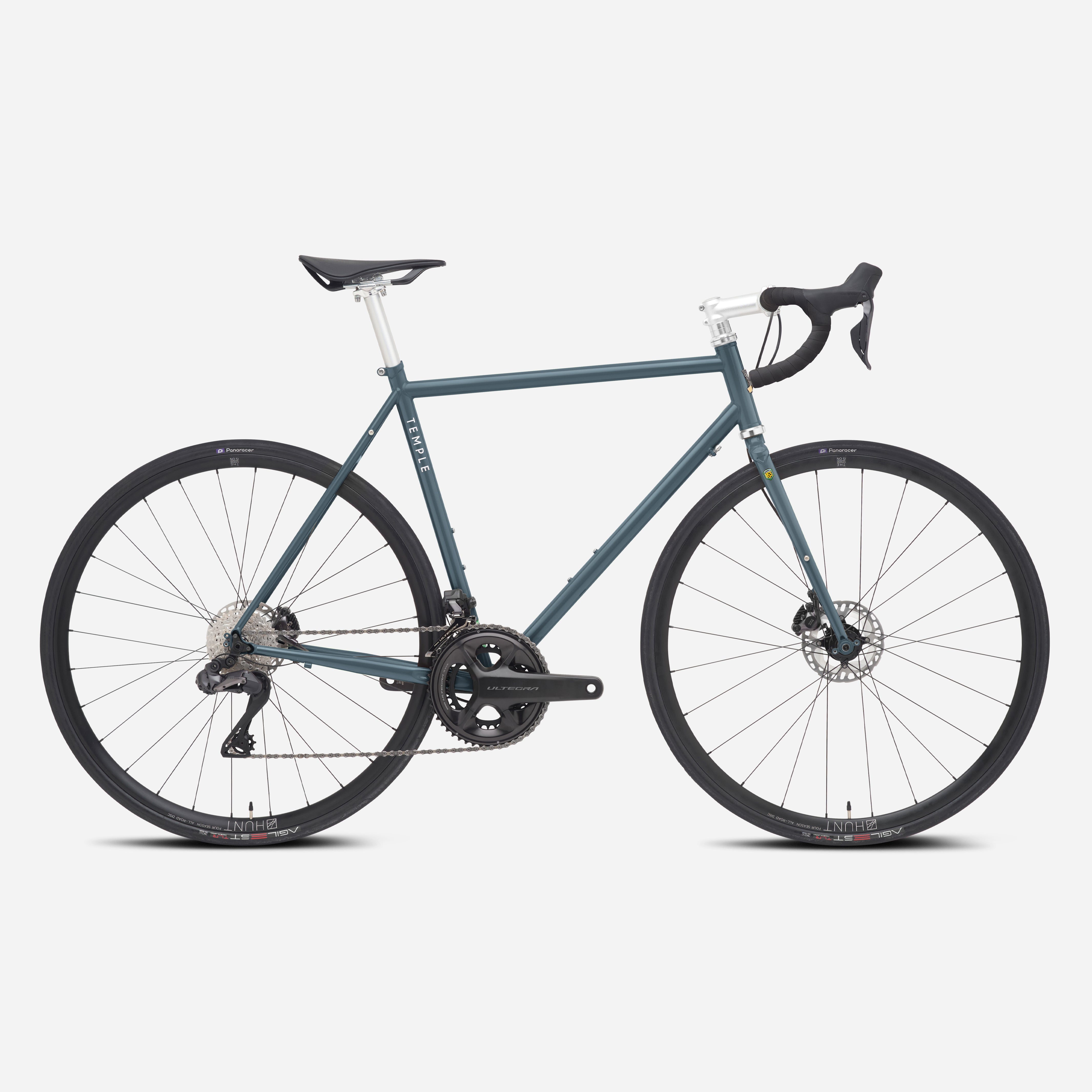 Navy versatile, durable road bicycle, studio setting.