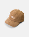 Brown corduroy cap made with 100% cotton, side view, studio setting.