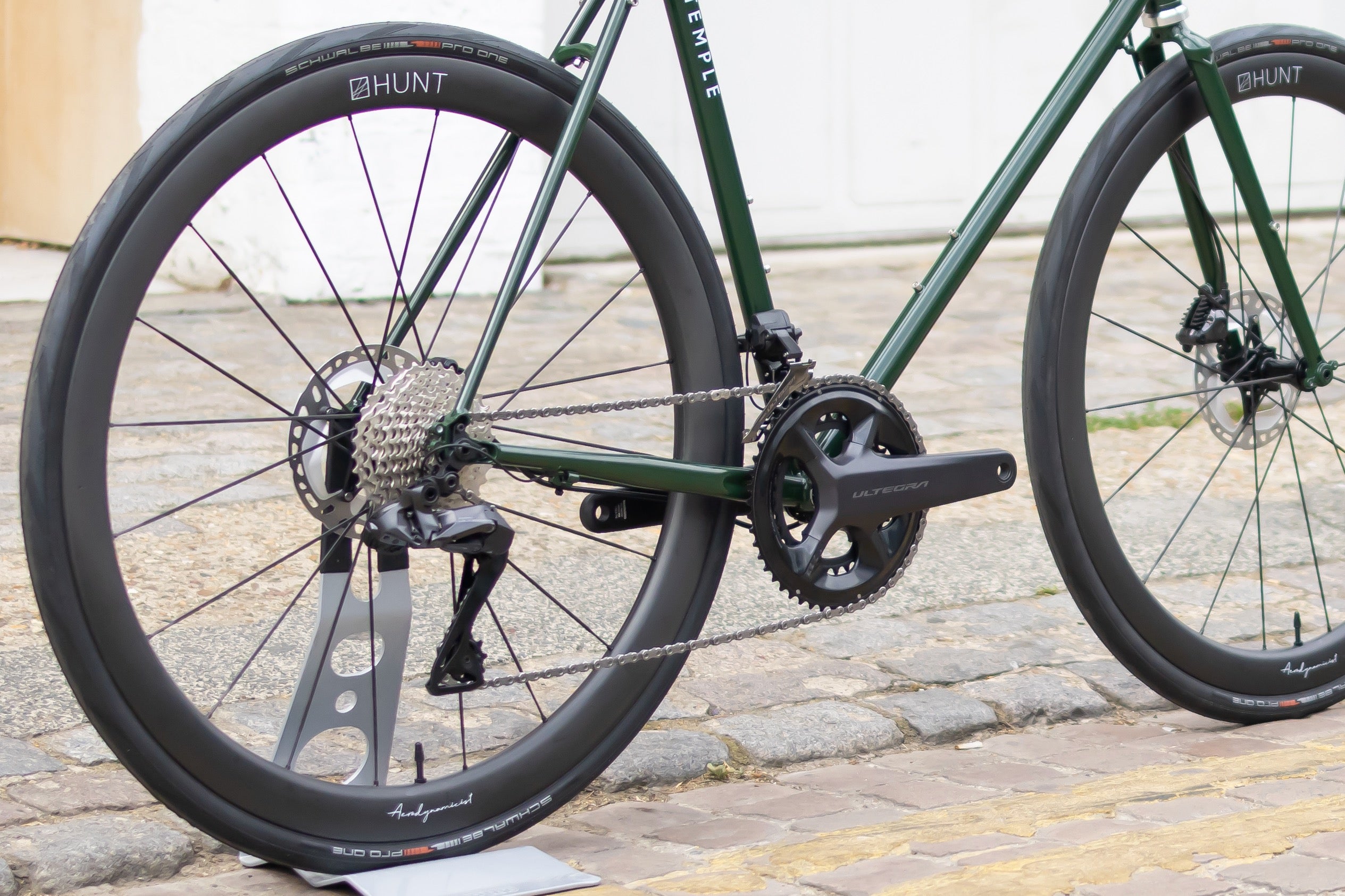 Shimano chainset on a durable road bike, urban setting. 