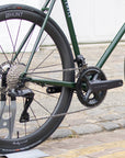 Shimano chainset on a durable road bike, urban setting. 