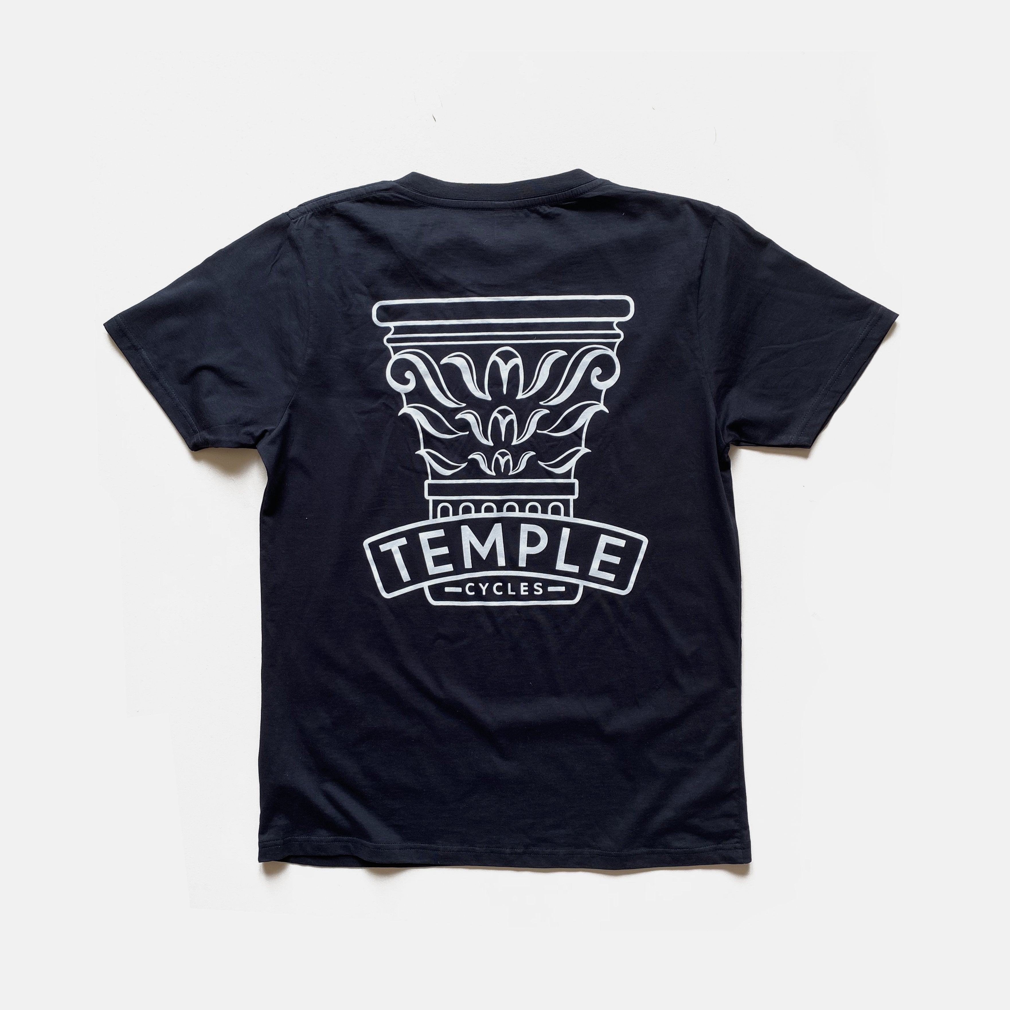 Silkscreen printed women’s graphic tee in navy with Temple Cycles logo, studio setting.