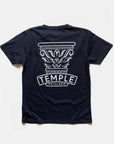 Silkscreen printed women’s graphic tee in navy with Temple Cycles logo, studio setting.