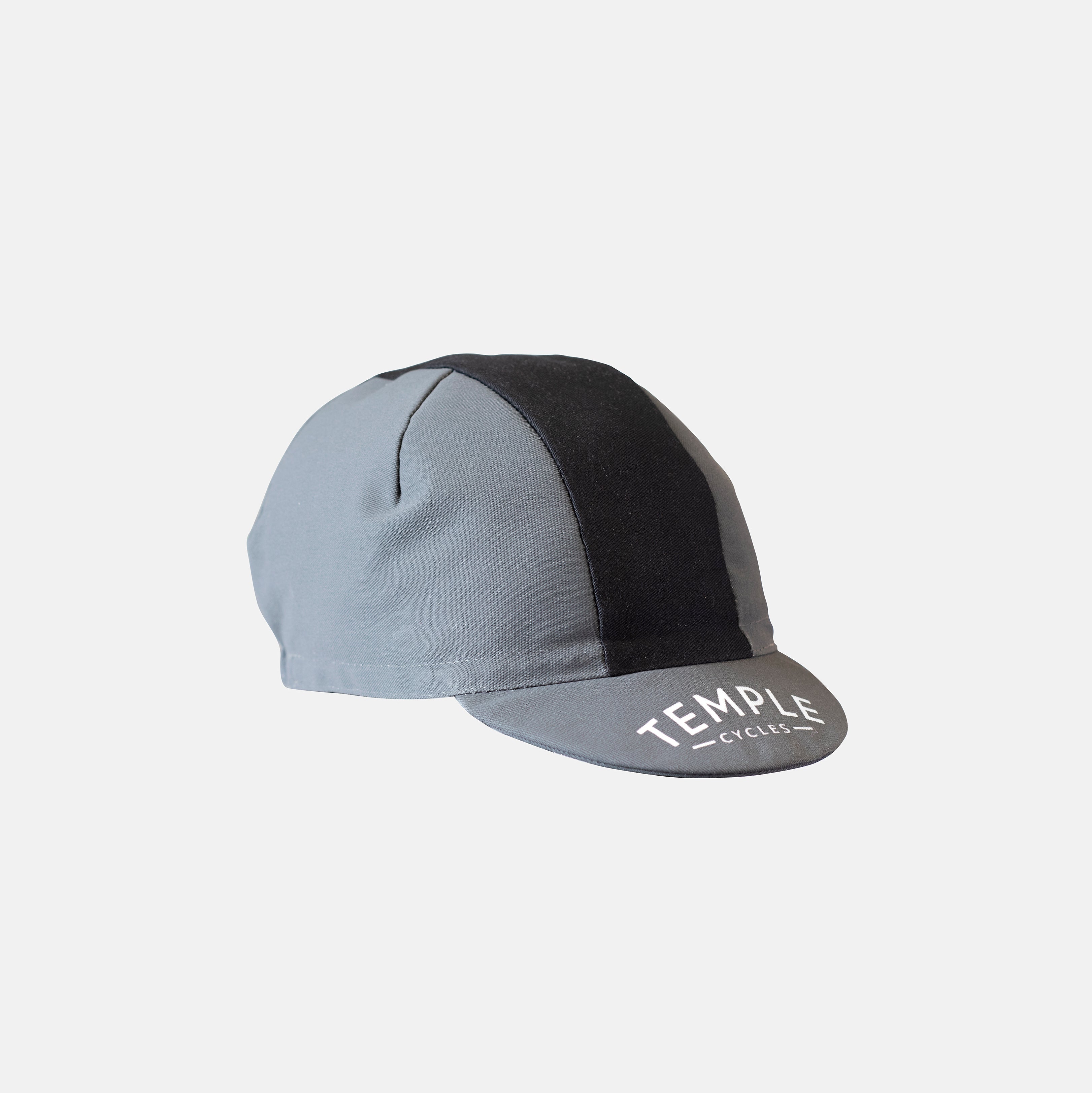 Grey and black striped cycling cap in a studio setting.