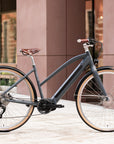 Adventure e-bike with classic minimalist design, urban setting.