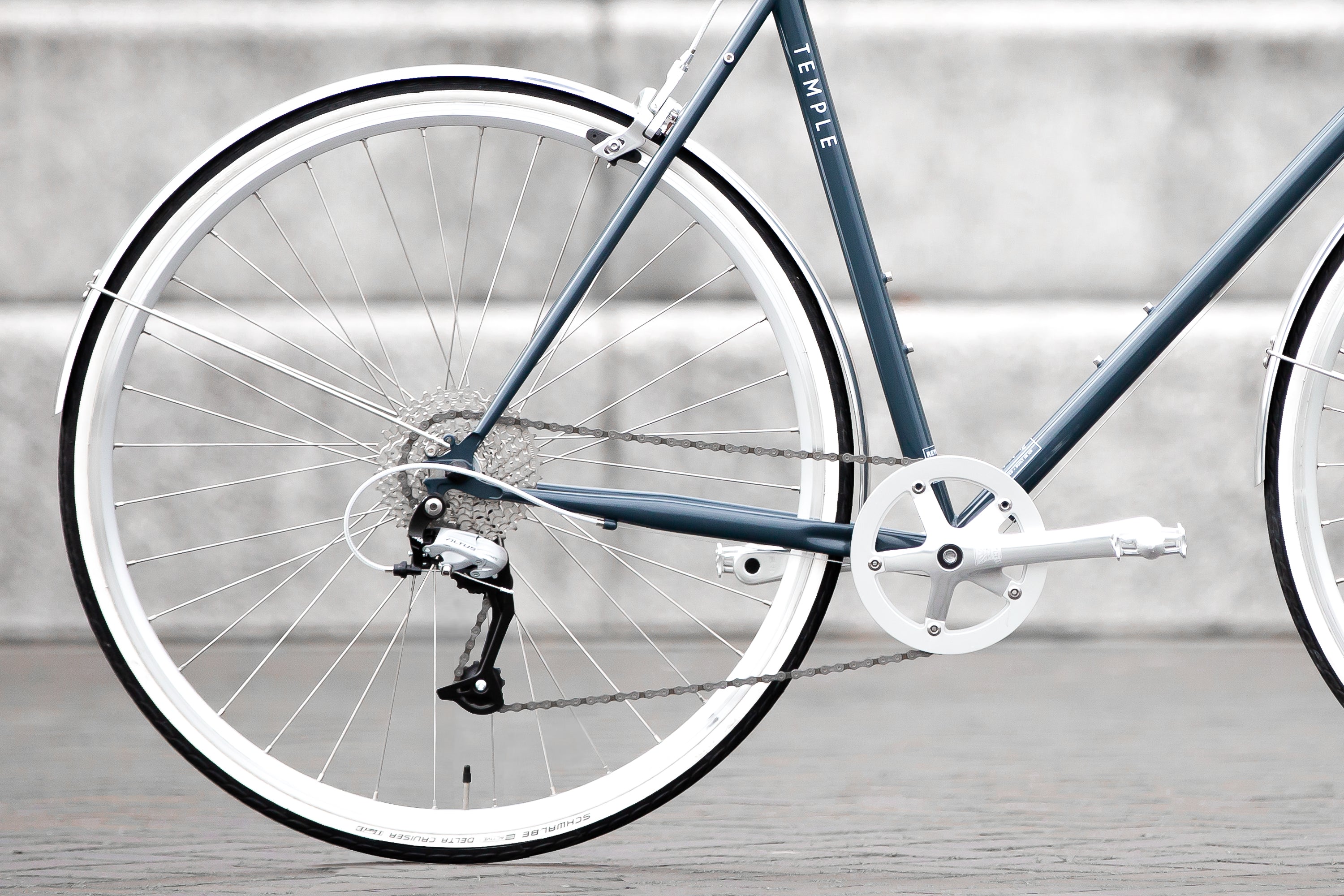 Rear wheel with Shimano hill-climbing gears on a classic lightweight steel bike.