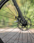 Front wheel handbuilt by Hunt with Shimano disc brakes on a lightweight touring bike.