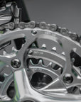 Shimano 105 chainset on a forest green, steel gravel bike.